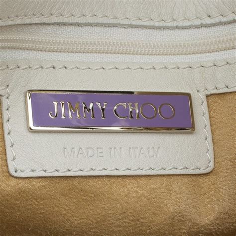 how to tell real versus fake jimmy choo bag|jimmy choo purse logo.